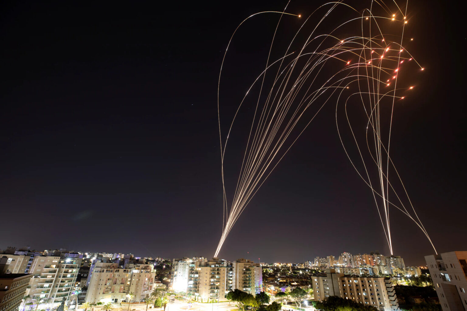 Streaks of light are seen as Israel's Iron Dome anti-missile system intercept rockets launched from the Gaza Strip towards Israel, as seen from Ashkelon, Israel May 12, 2021. REUTERS/Amir Cohen
