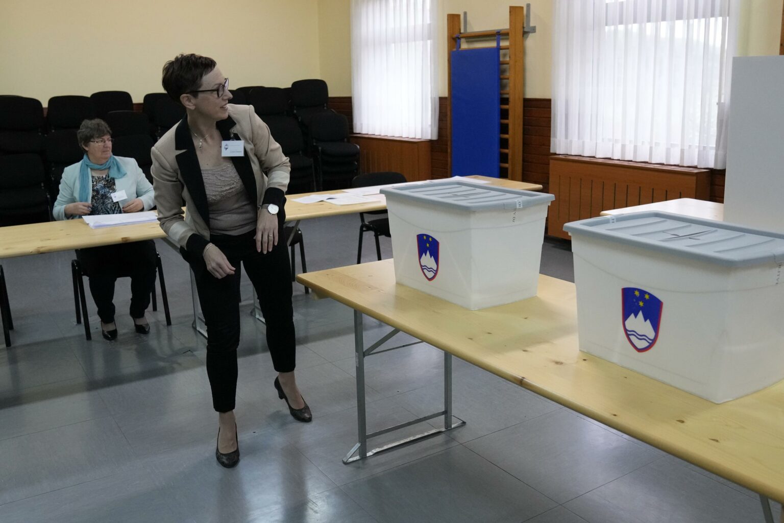 Slovenians vote in a tight race between populists, liberals