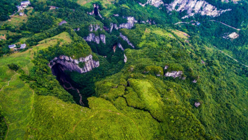 A 630-foot deep sinkhole with a forest hidden inside discovered in China.