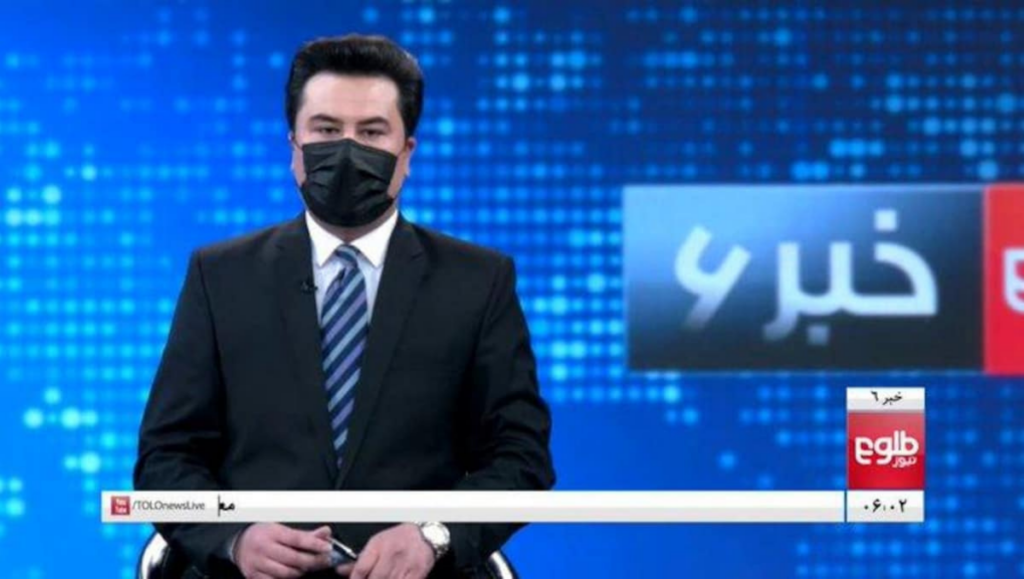 Following a Taliban rule for female newsreaders, male anchors wear masks on air. - Asiana Times