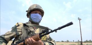 BSF soldier carrying gun at border