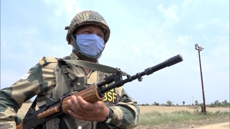 BSF soldier carrying gun at border