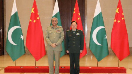 Vice Chairman of China's Central Military Commission (CMC) General Zhang Youxia (R) meets with the visiting Pakistan's Chief of Army Staff (COAS) General Qamar Javed Bajwa (L) in Qingdao, capital city of East China's Shandong province