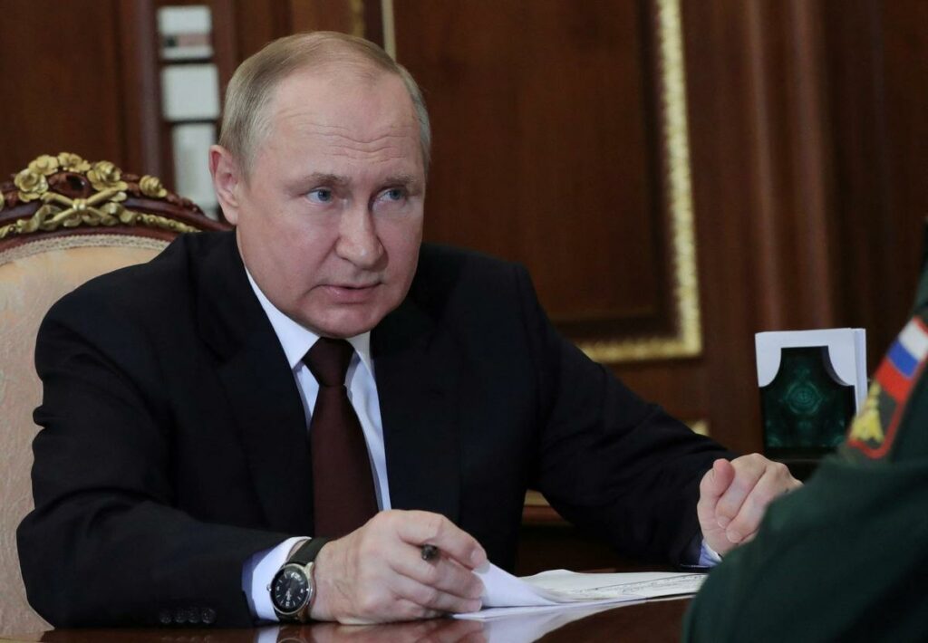 Russian President Vladimir Putin attends a meeting with Defence Minister Sergei Shoigu in Moscow.