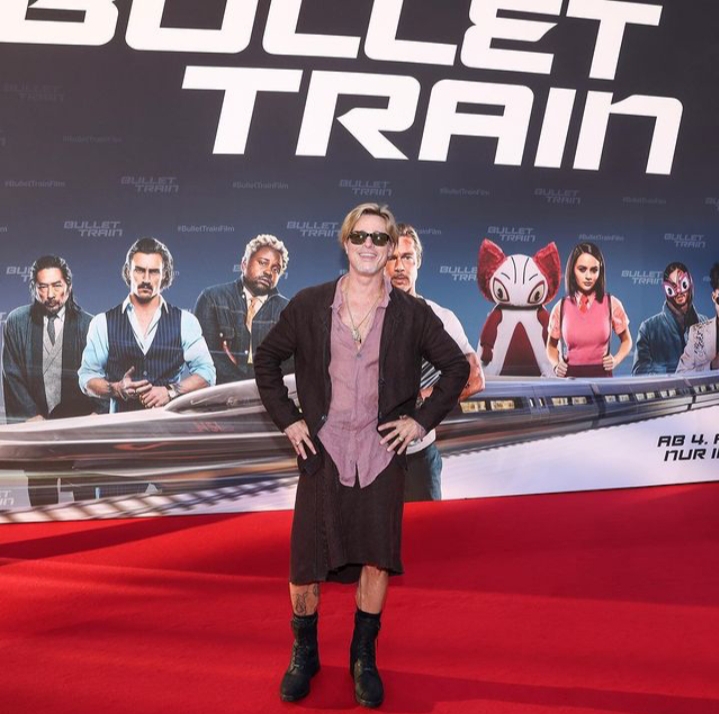 Brad Pitt's new look: wears a skirt for the premiere.