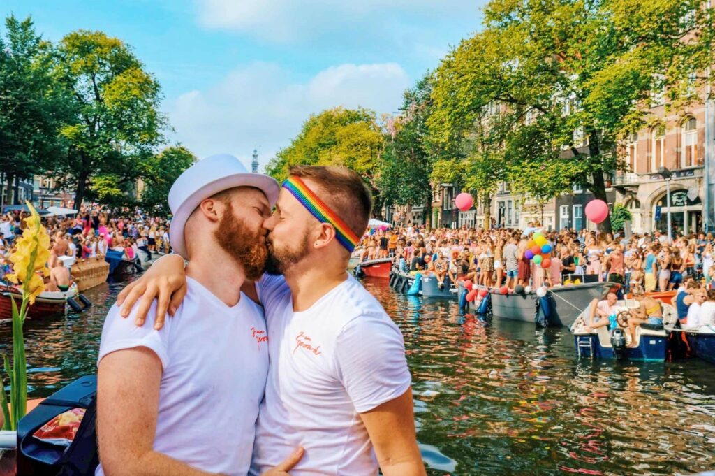 A huge crowd watches Amsterdam’s Pride canal Parade celebration  
