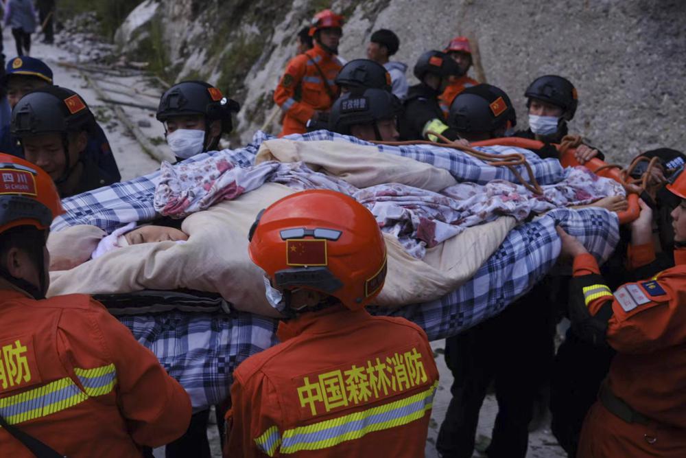 Earthquake in China triggers landslide; kills 65.