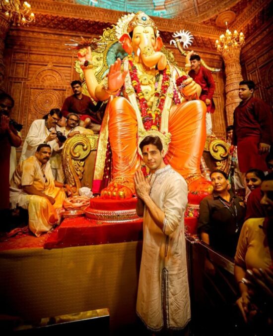 Sidharth Malhotra visits Lalbaugcha Raja with mother to take blessings.