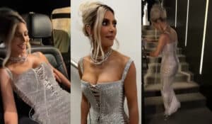 Kim Kardashian leaps up the stairs as she struggles to walk in a skintight, sparkly Dolce & Gabbana gown.