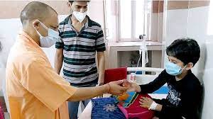 Yogi Ji meeting a young dengue patient