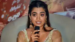 Rashmika Mandanna is speaking and wearing a white saree