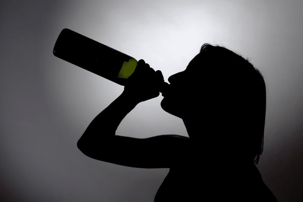 woman drinking alcohol in Bihar
