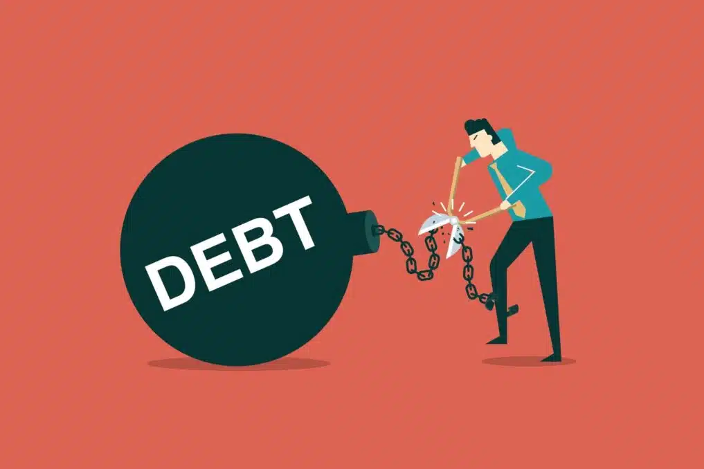 illustration of a man cutting his debt