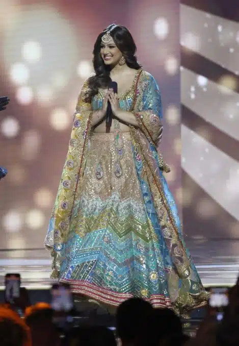 She wore a blue-and-pink lehenga further invigorated with vivid accents and sequined embellishments. 