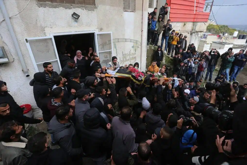 A funeral procession in Jenin after a young man was killed during an Israeli raid
