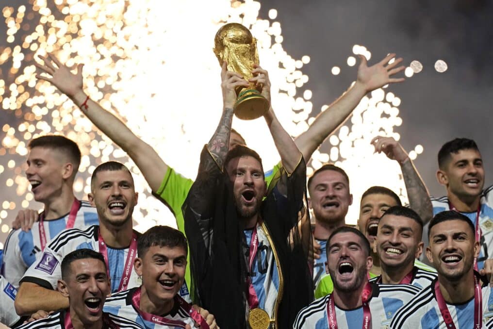 The Argentina team celebrates with a trophy after winning the FIFA World Cup 2022