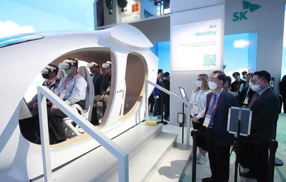 Visitors experience urban air mobility (UAM) at the SK Group's booth at CES 2023. 