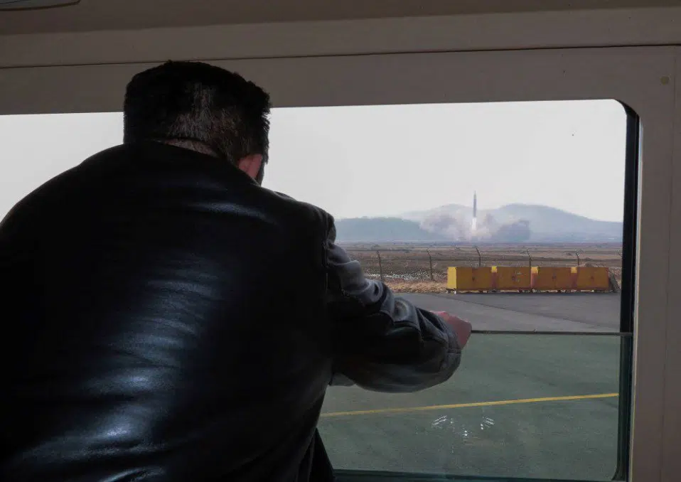 Kim Jong-Un watches the test of new type of ICBM developed by North Korea. (image source: KCNA via Reuters)