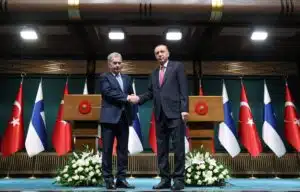 Turkey's President Tayyip Erdogan and Finland's President Sauli Niinisto shake hands