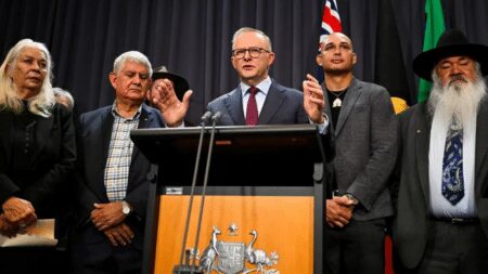 Australian Prime Minister Anthony Albanese, surrounded by members of the First Nations Referendum Working Group, speaks to the media during a news conference at Parliament House in Canberra, March 23, 2023.