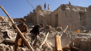 People clearing rubble aftermath an earthquake