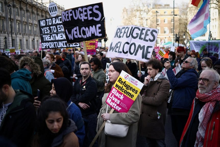 Protestors demonstrate against the government's immigration bill outside Downing Street in London