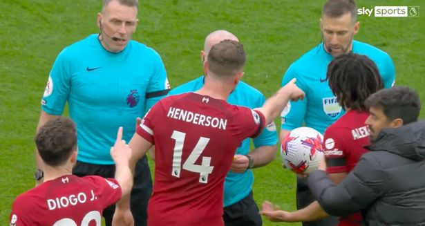 Jordan Henderson argues with referee over Robertson's incident.