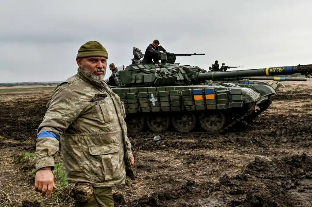 A Ukrainian service member stands next to a tank at a military training ground near a frontline, amid Russia's attack on Ukraine, in Zaporizhzhia region. 