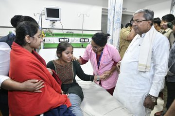 CM Siddaramaiah meets the bereaved family following the underpass accident.
