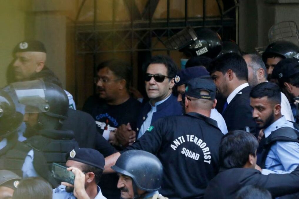 Imran Khan being escorted by security, as he appeared in Islamabad High Court.