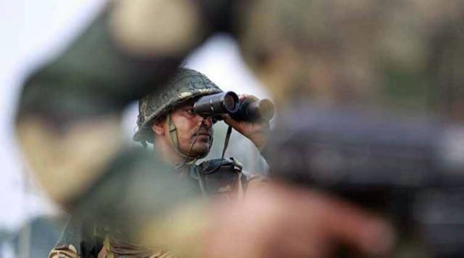 An army man monitoring his surroundings in Manipur