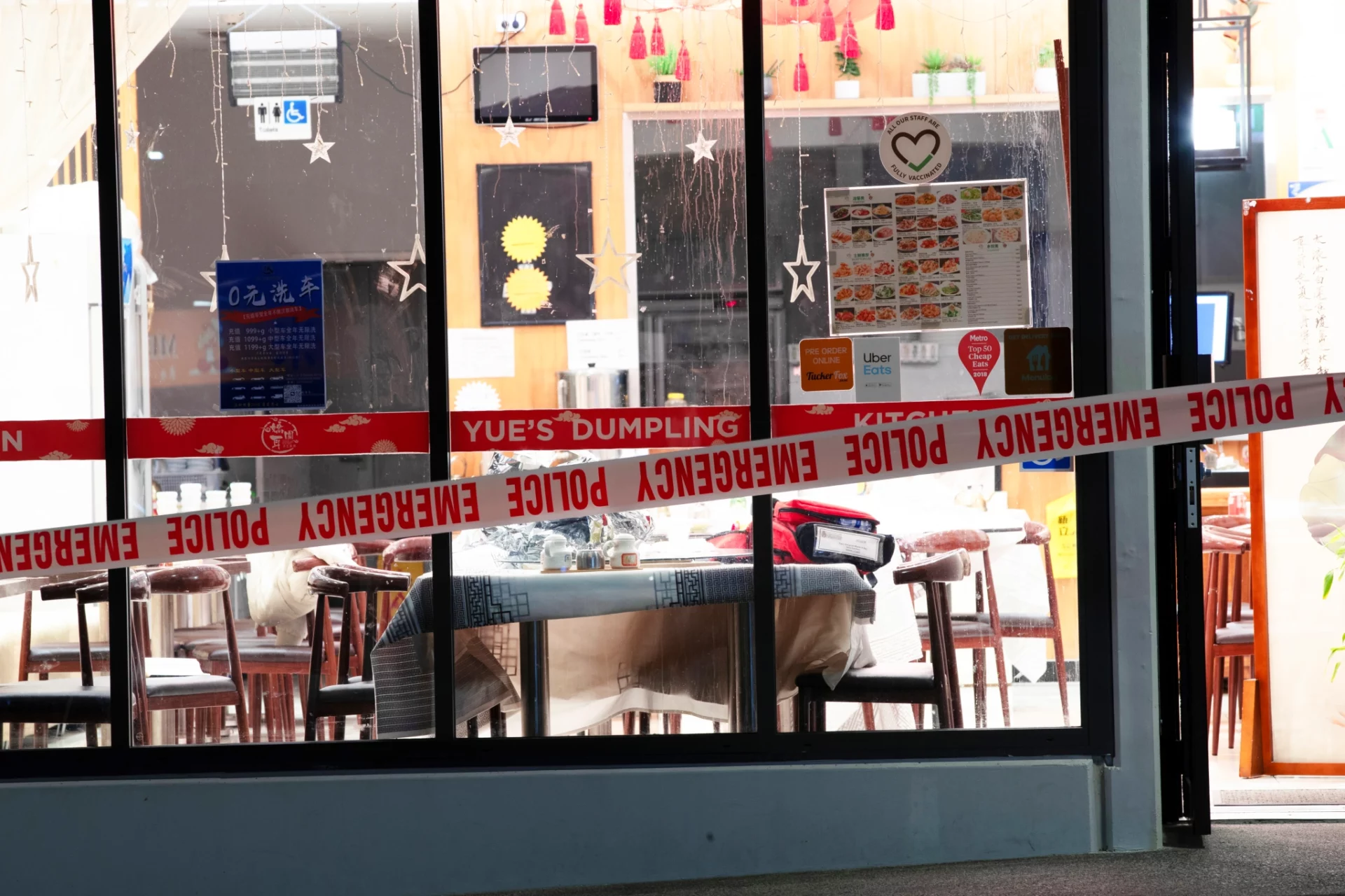 Police tape surrounds one of the restaurants on Corinthian Drive, in Albany, where a number of people were attacked by a man wielding an Axe.
