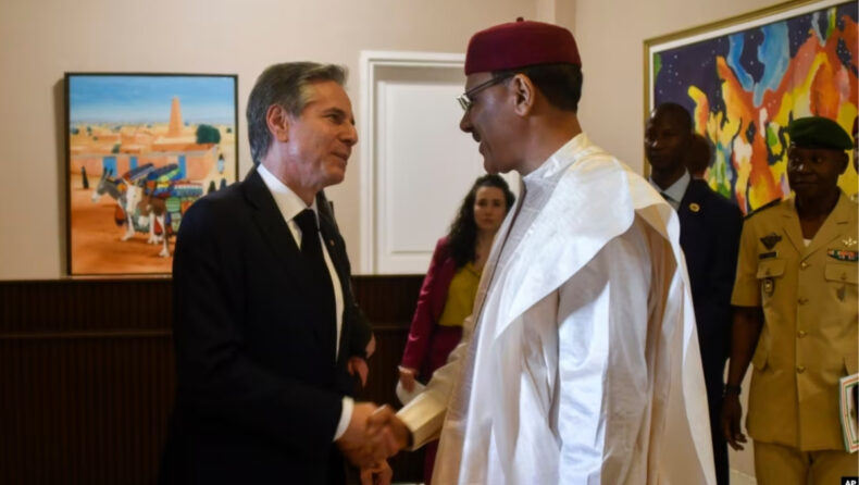 U.S. Secretary of State Antony Blinken left shakes hands with Nigerien President Mohamed Bazoum