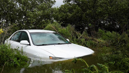 A vehicle is partially submerged after the arrival of Hurricane Idalia, in Cedar Key, Florida, U.S., on August 30, 2023 | Photo Credit: REUTERS