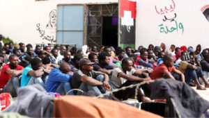 Video has emerged of a dead female refugee's body lying on the floor of the Abu Salim detention centre in Tripoli, Libya (Image Source: EPA/STR)