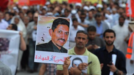 A protester holds a picture of the human rights activist Abdulhadi al-Khawaja during a rally demanding his release in 2012. He has been in prison since 2011.