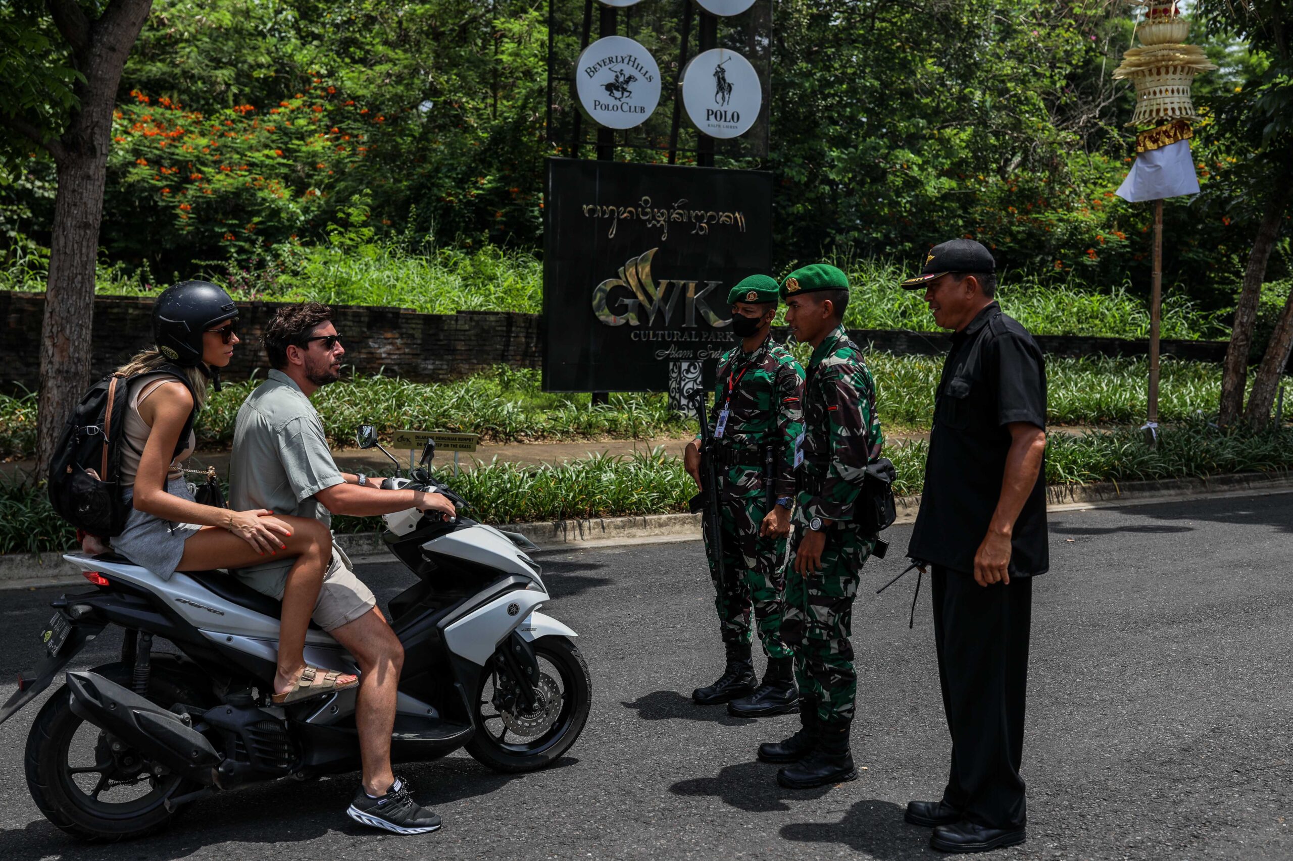 Tourists in Bali riding motorbikes