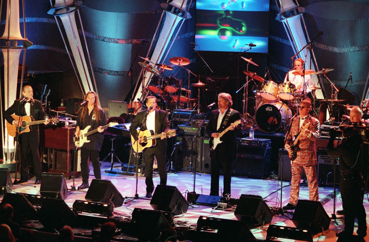 The Eagles performing onstage at the Rock and Roll Hall of Fame induction ceremony in 1998.