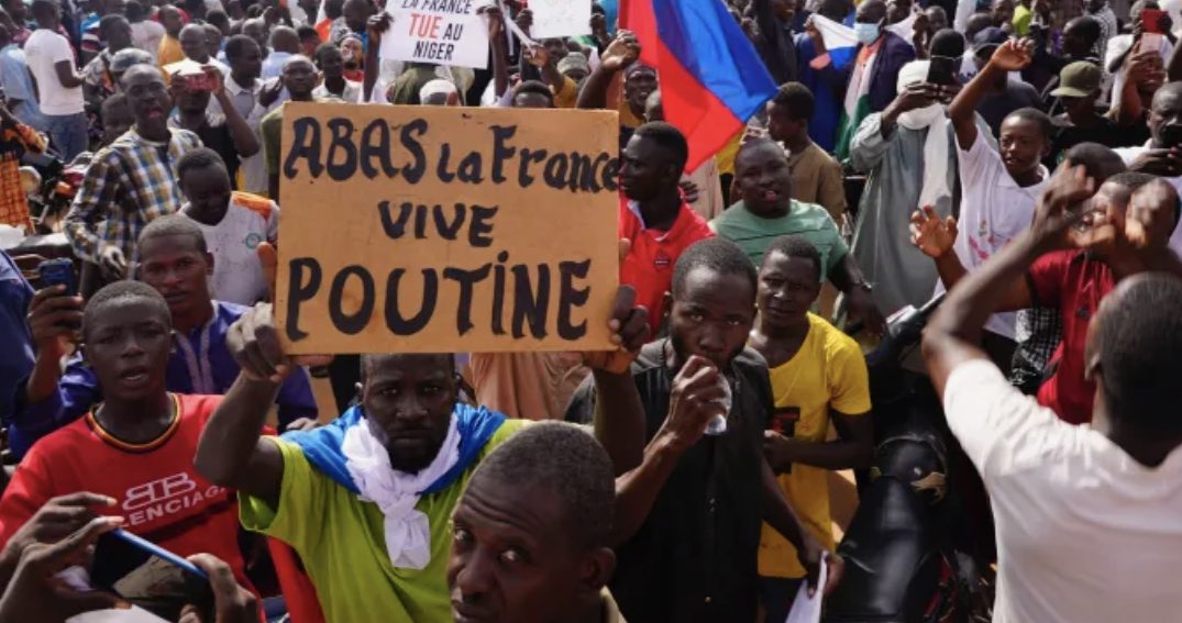 The Sahel region of Africa, marked by poverty, instability, and conflict, is once again grappling with the crisis, as shown by the individuals in Nigeria take part in a rally organized by followers of coup leader Gen. Abdourahmane Tchiani in Niamey, Niger, on Sunday, July 30, 2024. One of the signs displayed reads: "Against France, in favor of Putin."