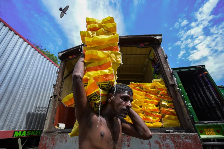 WORKER TAKING OUT WHEAT BAGS IN CAPITAL
