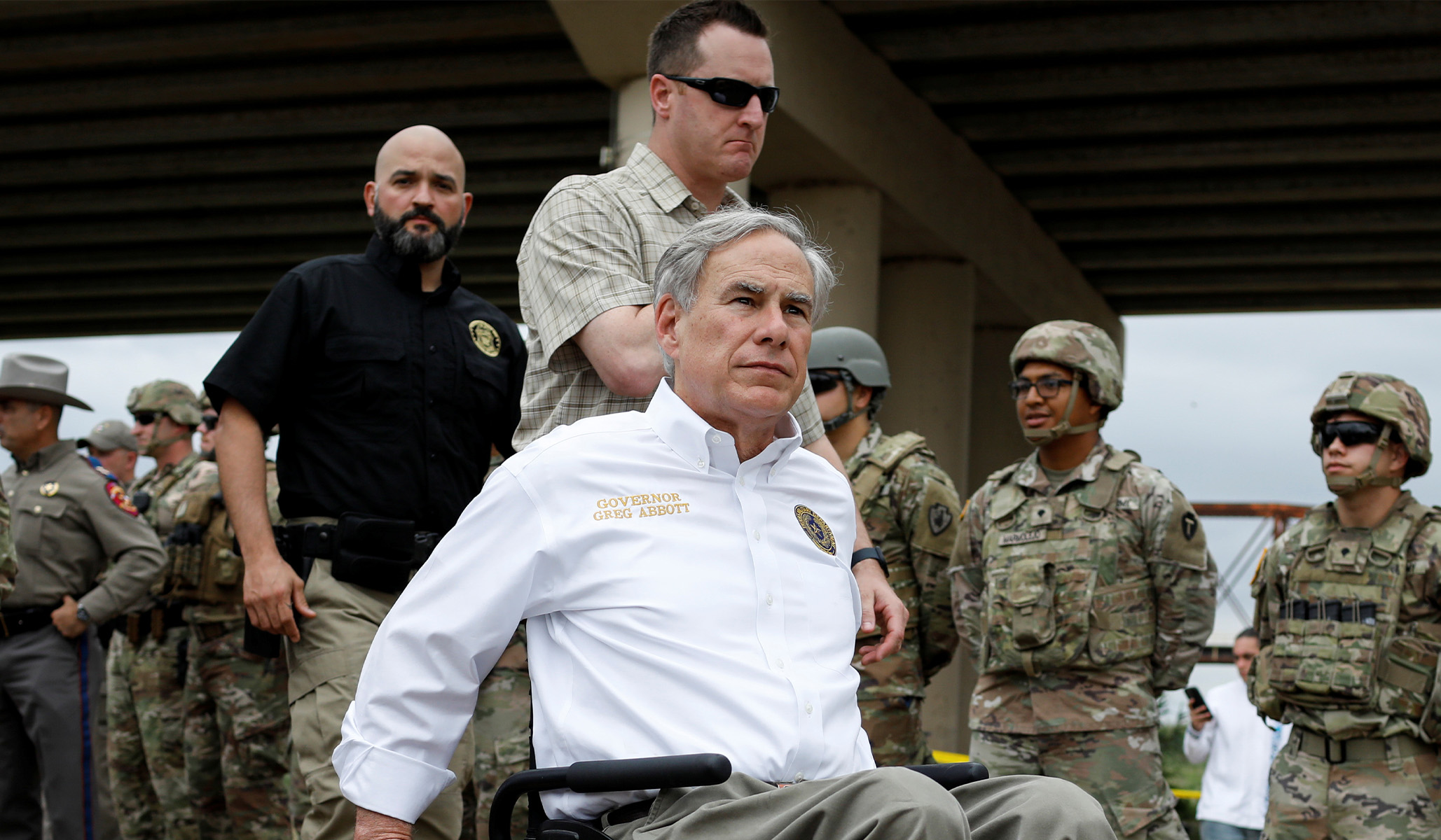 Texas governor Greg Abbott leaves after a visit to the north banks of the Rio Grande.