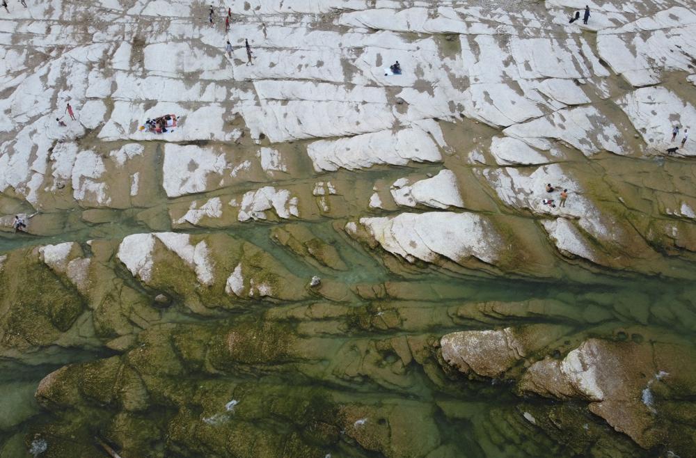 Italy’s Lake Garda shrinks to a near-historic low amid the drought.