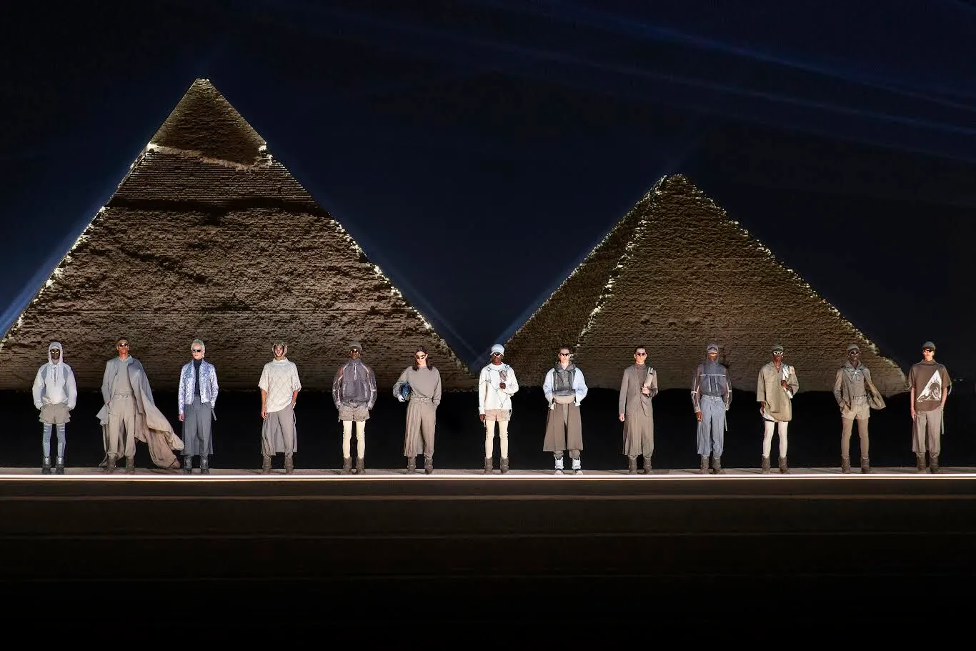 Dior fashion walk against the backdrop of Egyptian pyramids.