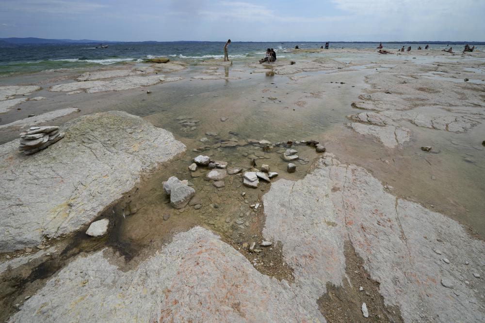 Italy’s Lake Garda shrinks to a near-historic low amid the drought.